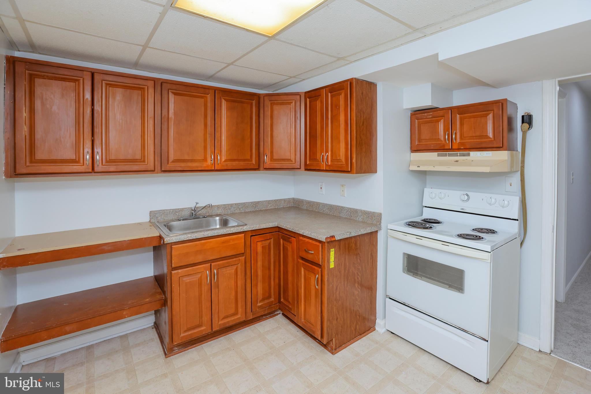 30 Queen Anne Road Glen Burnie, MD 21060 - Photo 41 of 47 a kitchen with stainless steel appliances granite countertop a stove a sink and a refrigerator