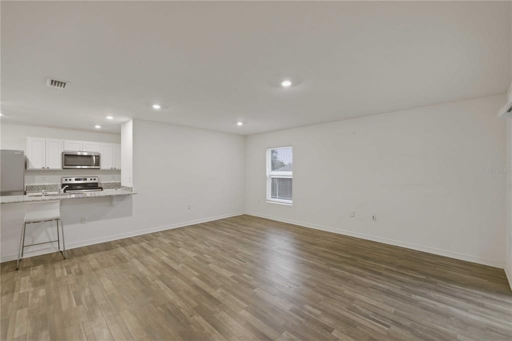 260 Emerald Road Ocala, FL 34472 - Photo 12 of 29 a view of kitchen with sink and wooden floor