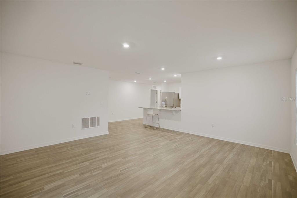 260 Emerald Road Ocala, FL 34472 - Photo 13 of 29 a view of empty room with wooden floor and window