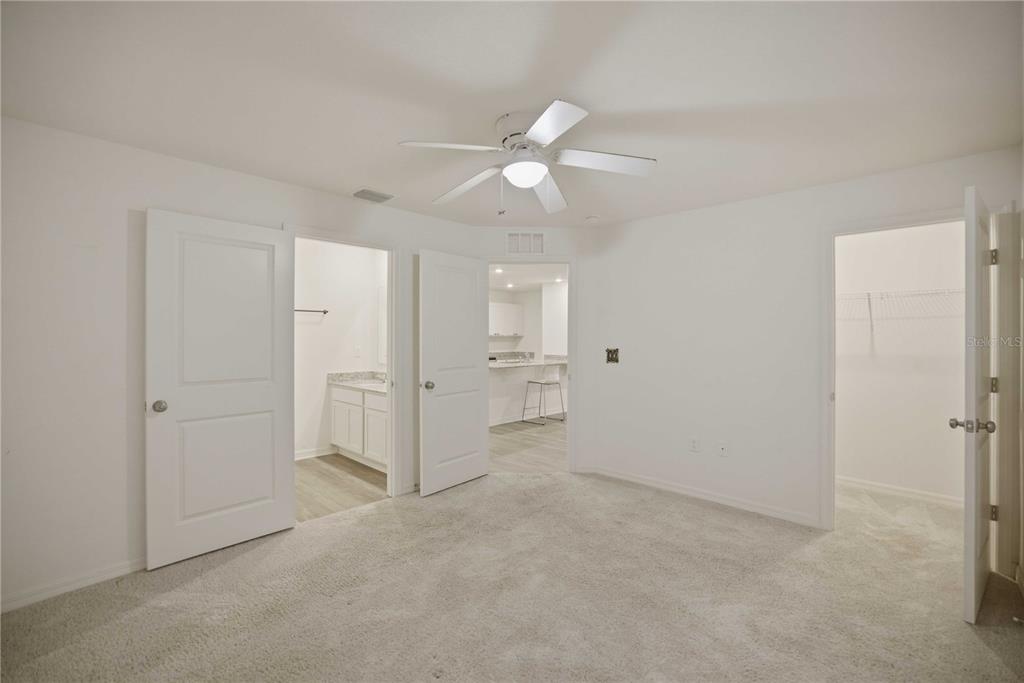 260 Emerald Road Ocala, FL 34472 - Photo 16 of 29 wooden floor in an empty room and a ceiling fan