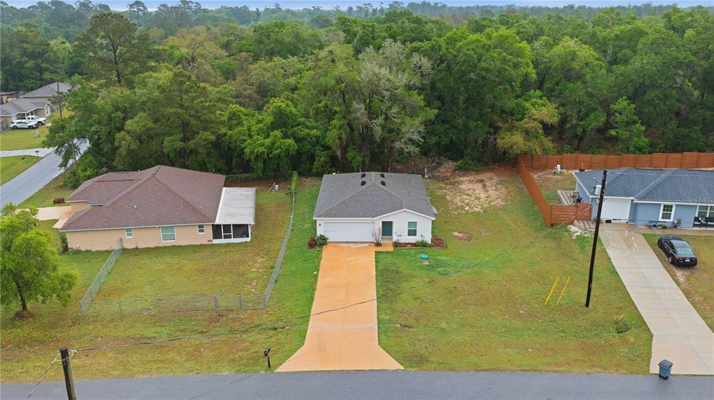 260 Emerald Road Ocala, FL 34472 - Photo 2 of 29 an aerial view of a house with a yard basket ball court and outdoor seating