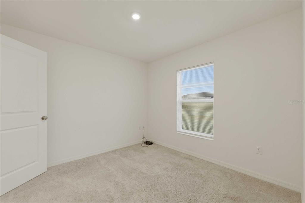 260 Emerald Road Ocala, FL 34472 - Photo 23 of 29 a view of an empty room with a window