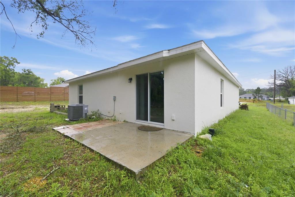 260 Emerald Road Ocala, FL 34472 - Photo 29 of 29 a view of a house with backyard and garden
