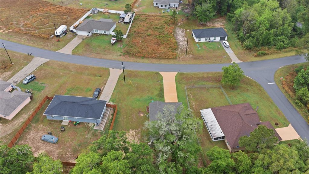 260 Emerald Road Ocala, FL 34472 - Photo 6 of 29 an aerial view of a house with outdoor space and a lake view