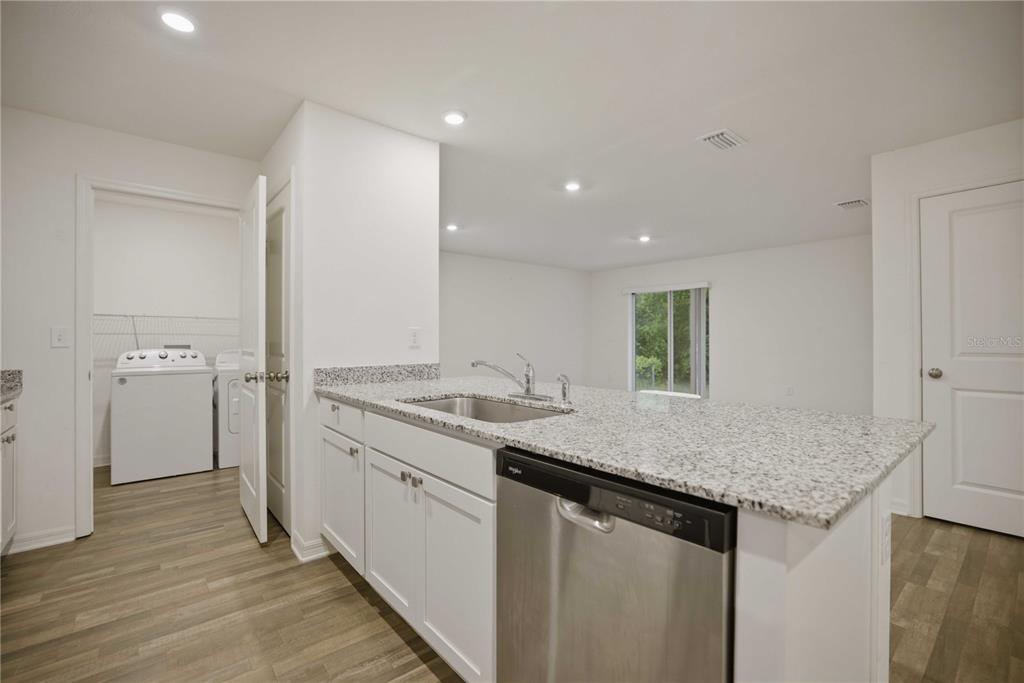 260 Emerald Road Ocala, FL 34472 - Photo 10 of 29 a kitchen with a sink and cabinets