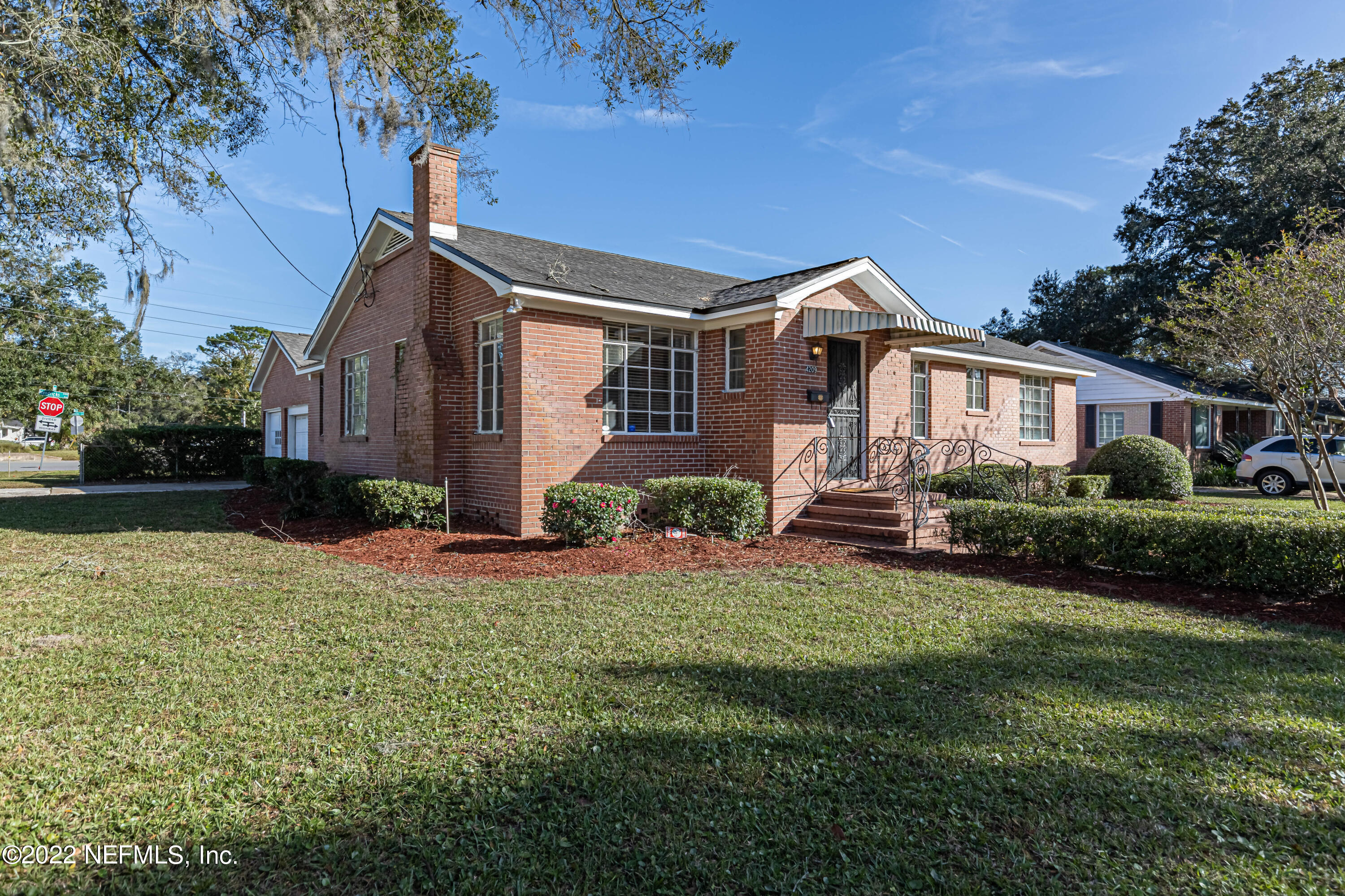 4209 Birmingham Road Jacksonville, FL 32207 - Photo 1 of 35 a front view of a house with a yard