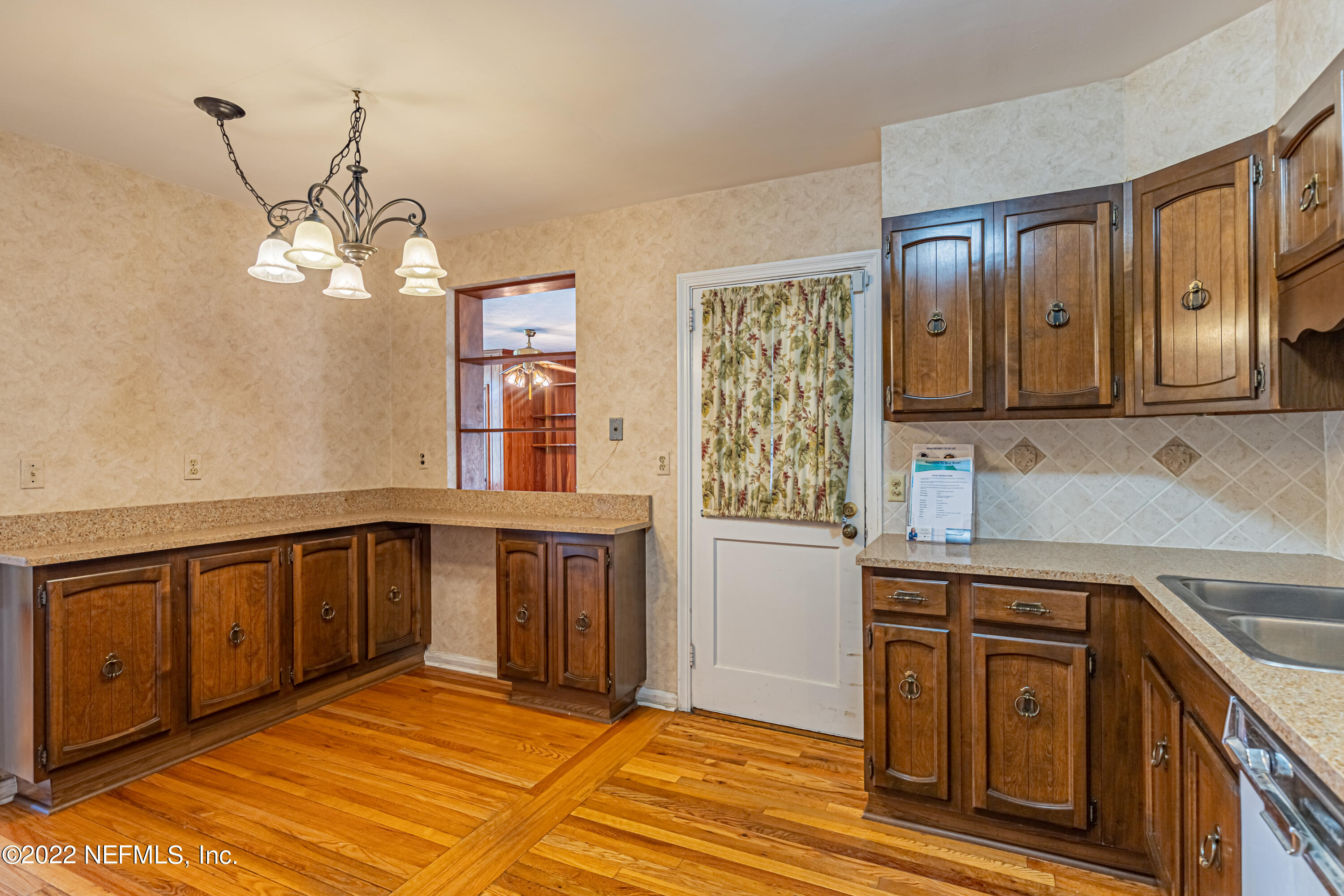 4209 Birmingham Road Jacksonville, FL 32207 - Photo 17 of 35 a kitchen with stainless steel appliances granite countertop a cabinets sink and dishwasher