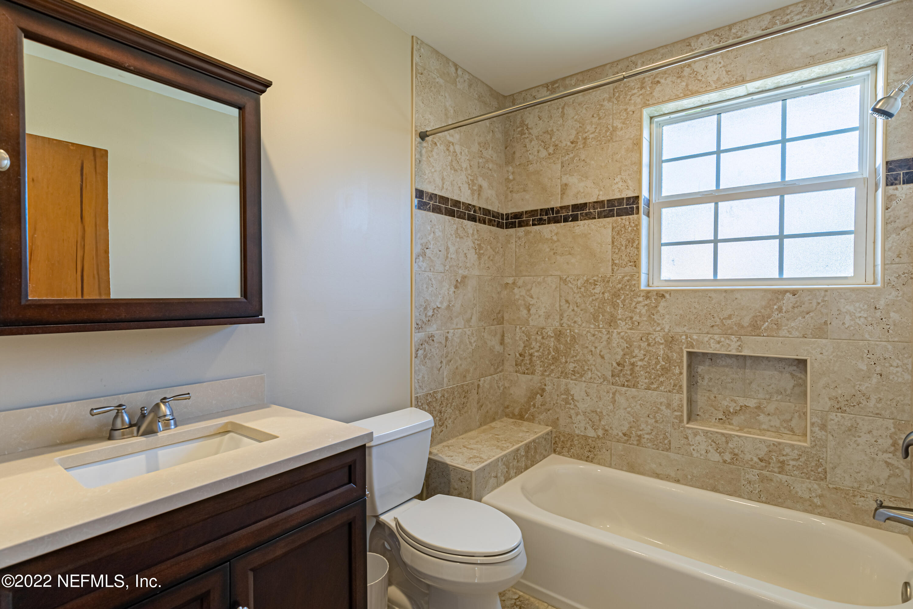 4209 Birmingham Road Jacksonville, FL 32207 - Photo 19 of 35 a bathroom with a sink a toilet and a bathtub