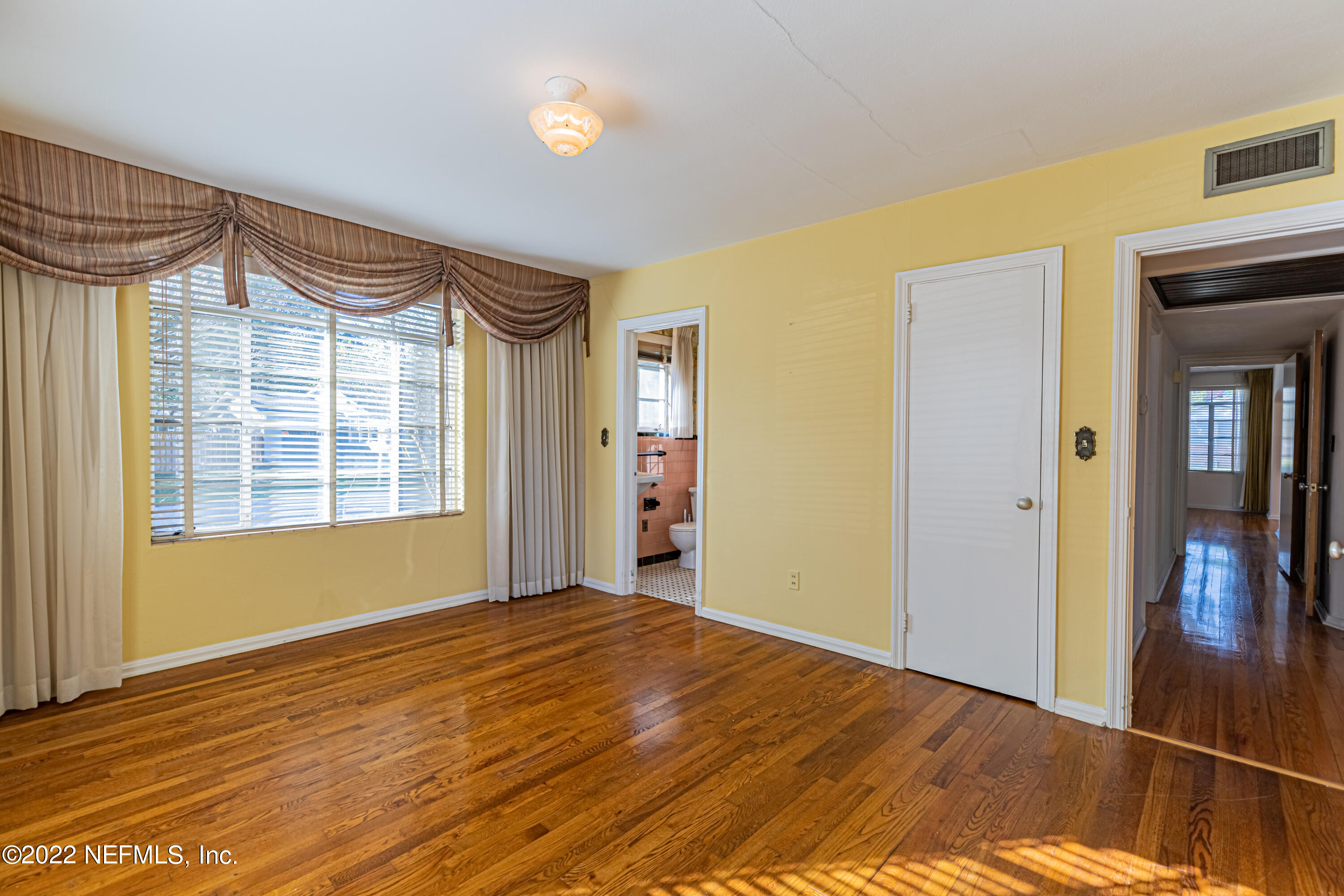 4209 Birmingham Road Jacksonville, FL 32207 - Photo 20 of 35 a view of empty room with wooden floor and fan
