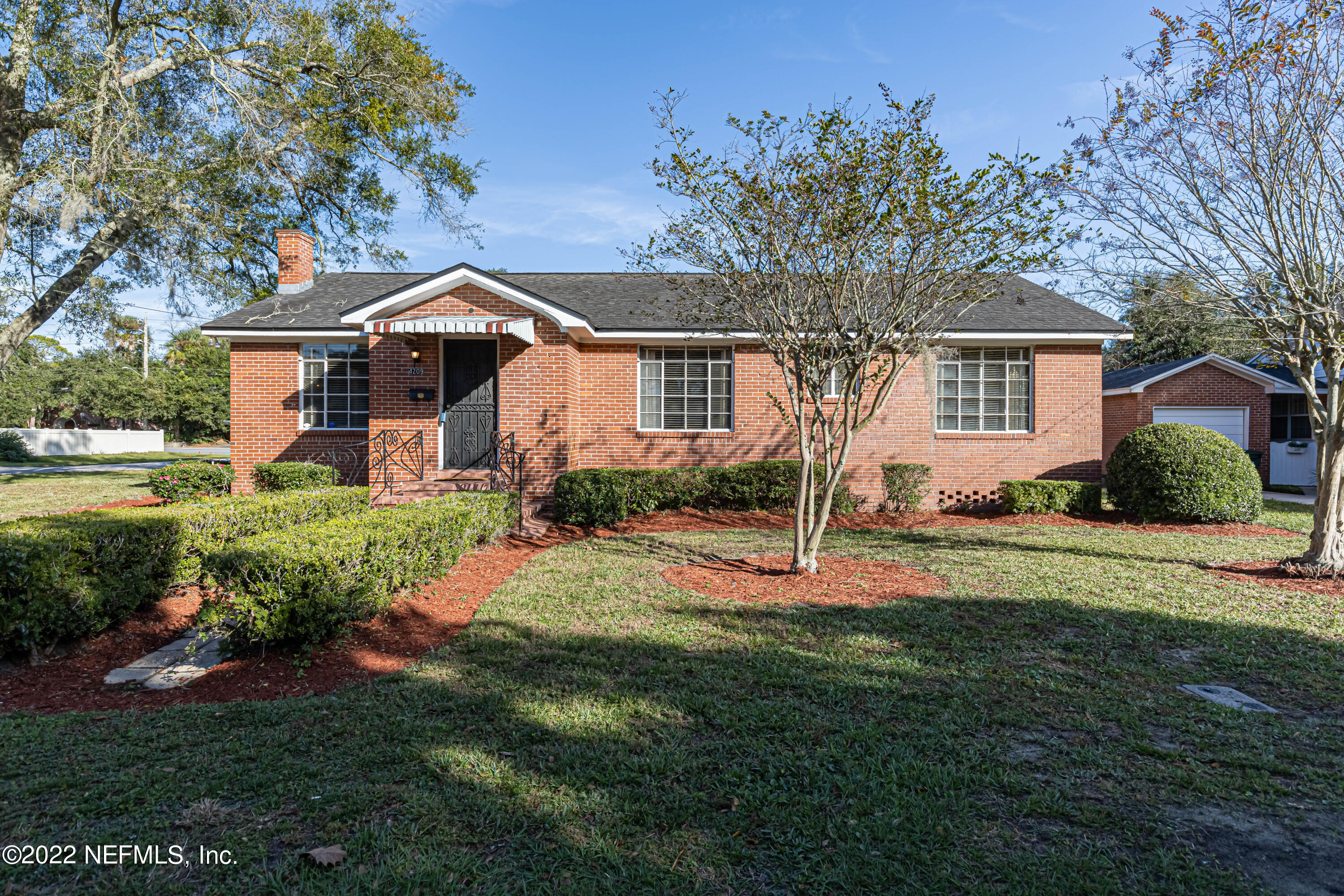 4209 Birmingham Road Jacksonville, FL 32207 - Photo 2 of 35 a front view of a house with a yard