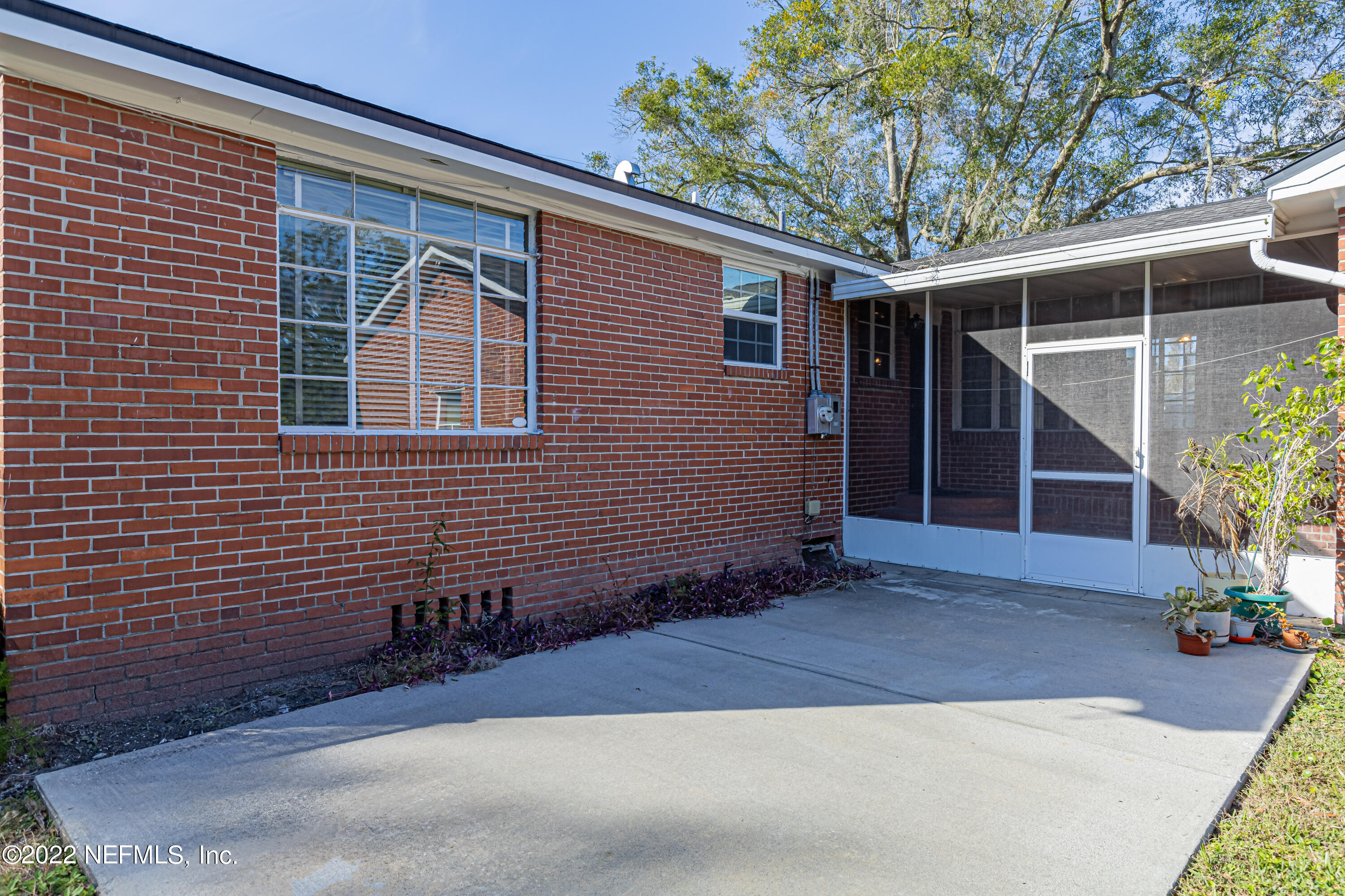 4209 Birmingham Road Jacksonville, FL 32207 - Photo 29 of 35 a front view of a house with a yard and garage