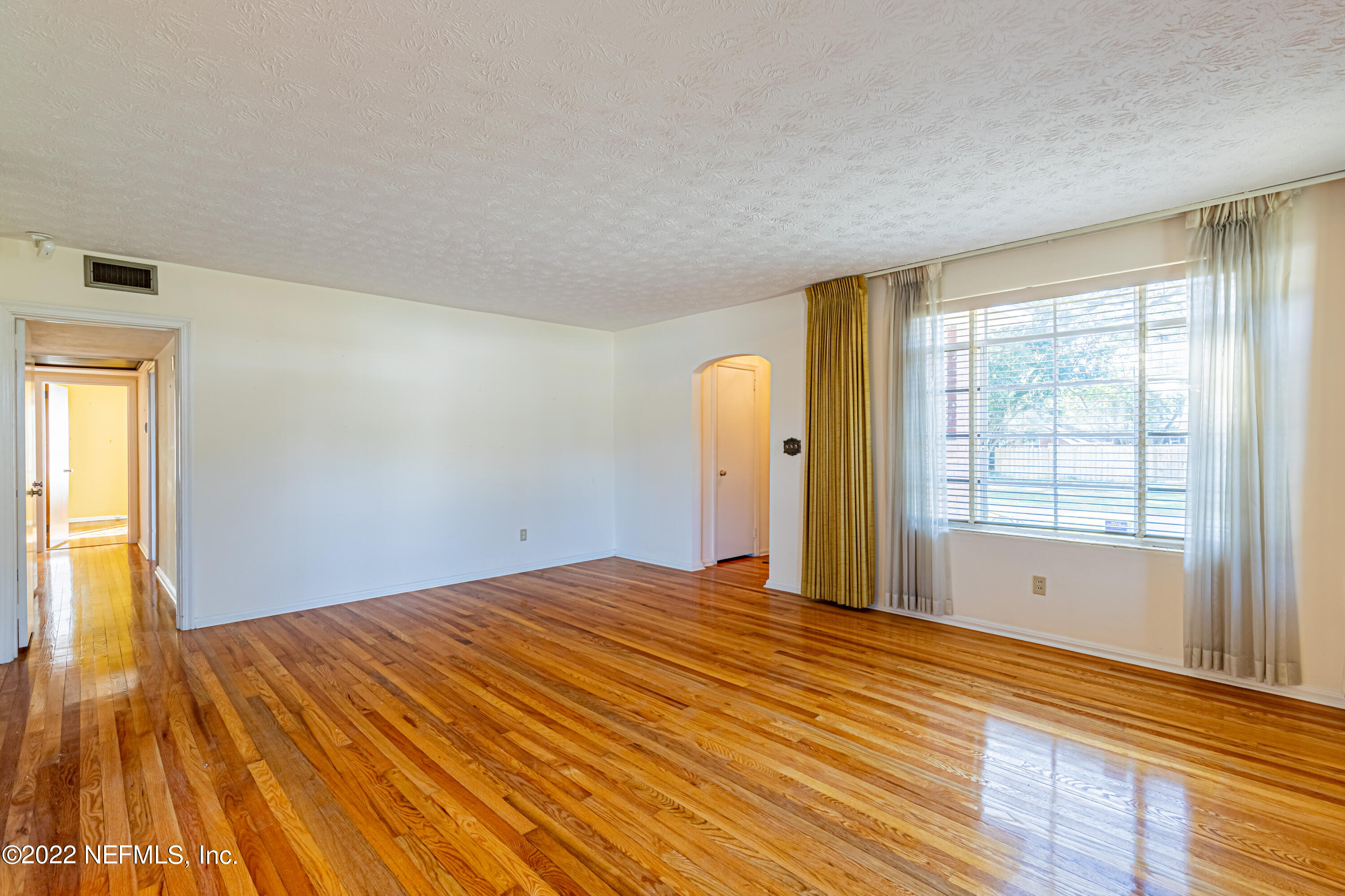 4209 Birmingham Road Jacksonville, FL 32207 - Photo 7 of 35 a bedroom with a bed and a window