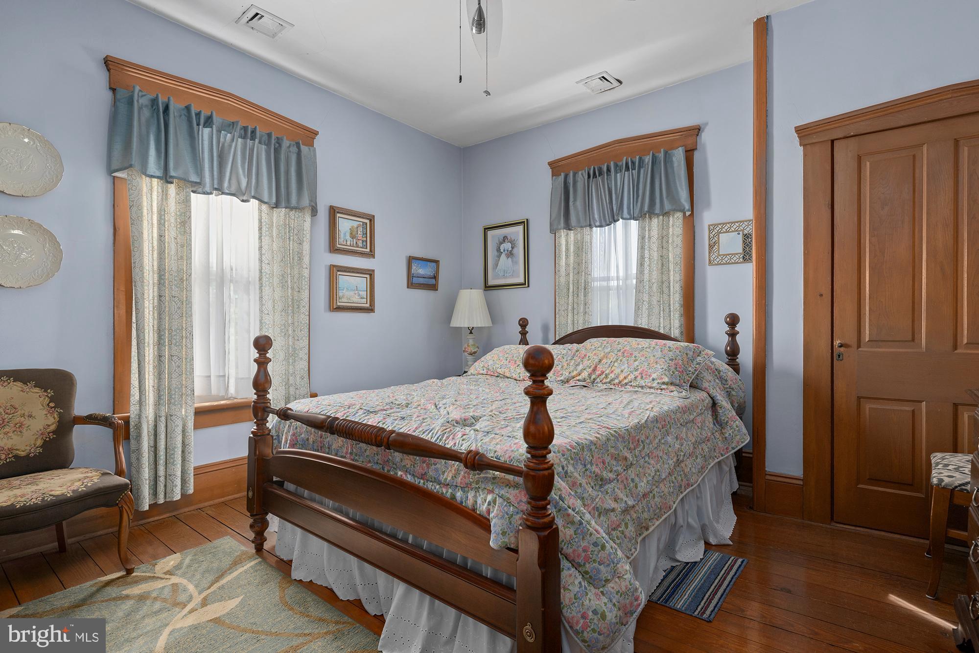 7541 Middleburg Road Keymar, MD 21757 - Photo 39 of 53 a bed sitting in a bedroom next to a window
