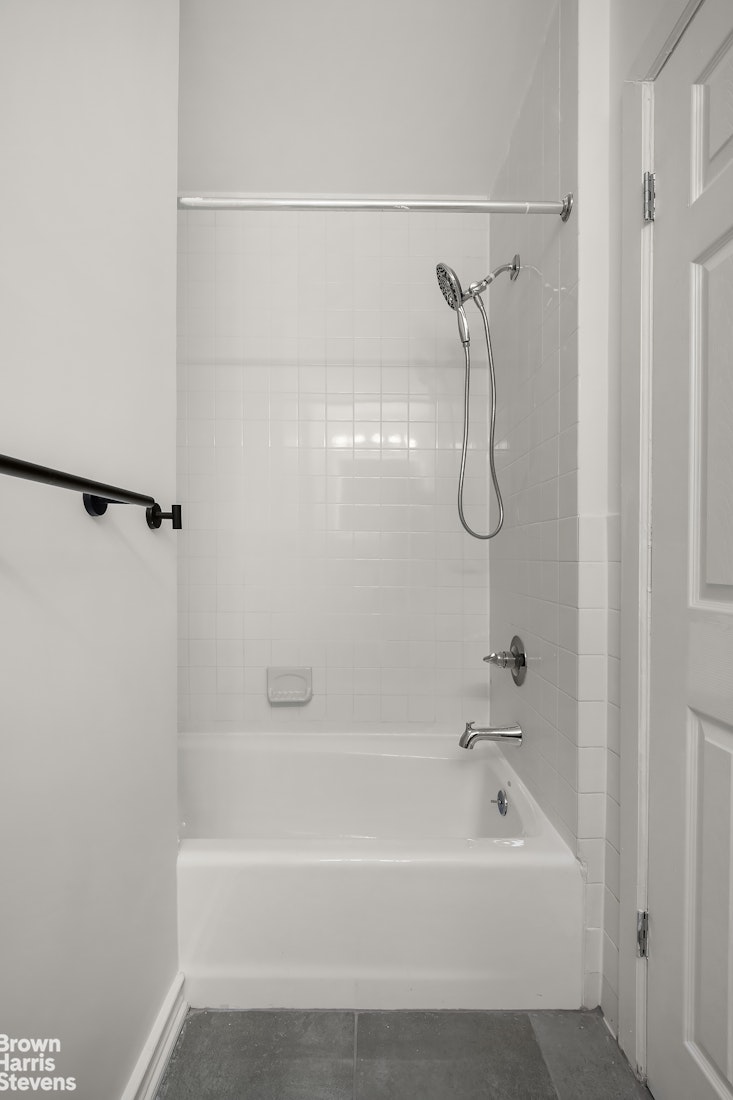 29 West 119th Street, Unit 3 Manhattan, NY 10026 - Photo 11 of 14 a bathroom with a bath tub with a shower