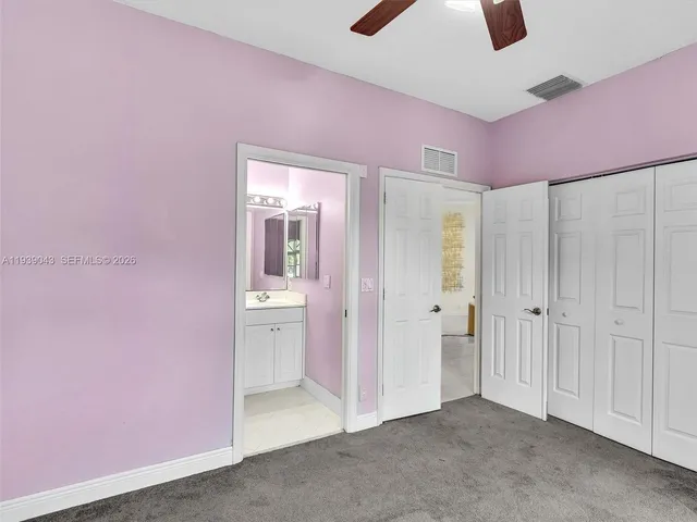 a bed room with a bed and a flat screen tv