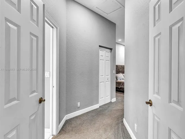 a spacious bathroom with a bathtub sink and mirror