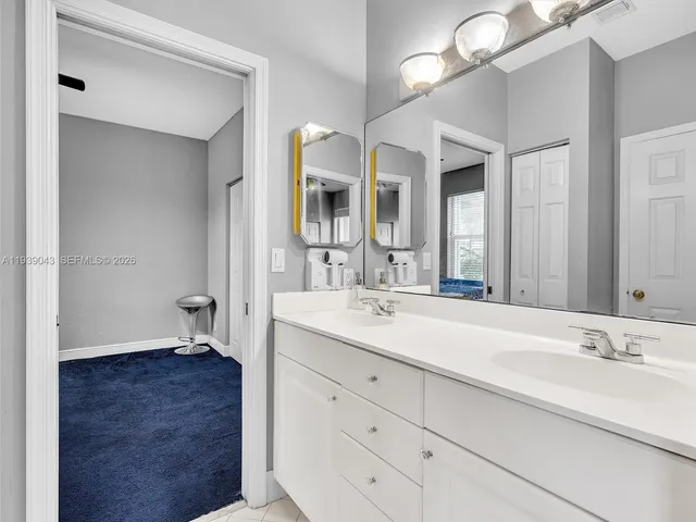 a white toilet sitting next to a shower curtain