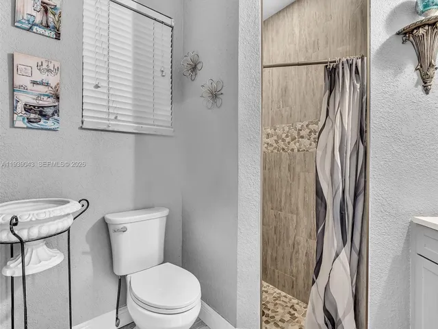 a view of a storage and utility room with washer and dryer