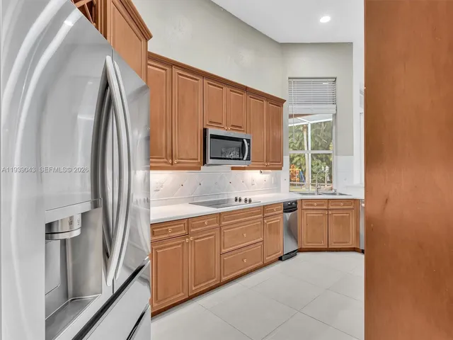 a view of a livingroom with furniture and floor to ceiling window