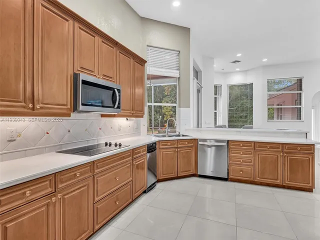a bedroom with furniture and a large window