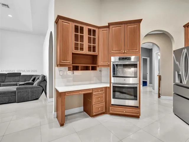 a view of a house with backyard porch and sitting area