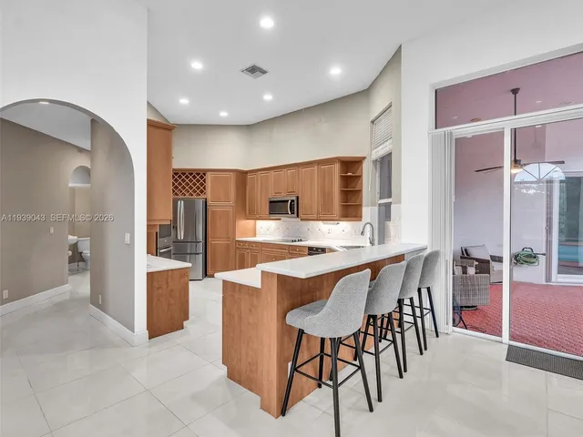 a view of a house with swimming pool and yard