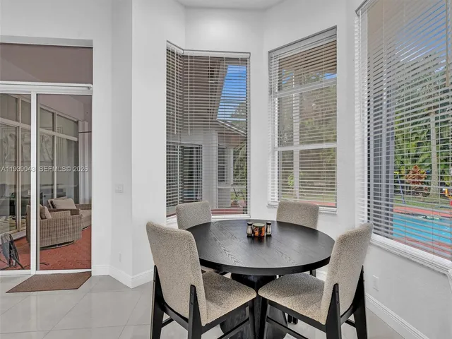 an aerial view of a house with a yard swimming pool a patio and yard