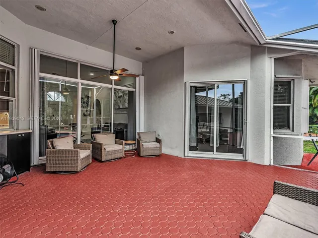 an aerial view of residential houses with outdoor space and swimming pool