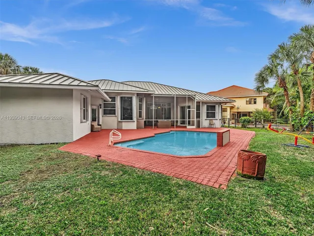 $940,000 | 8720 Northwest 18th Street, Coral Springs, FL 33071