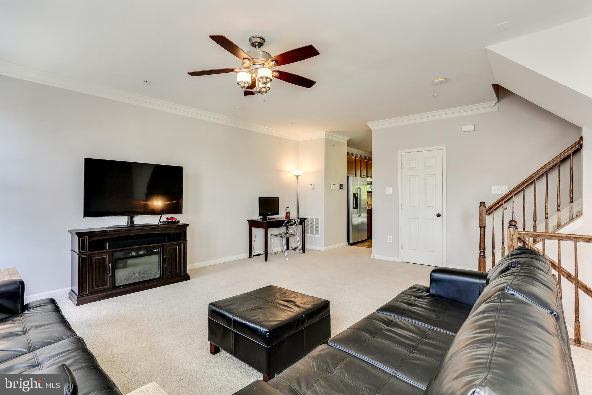 7128 Water Oak Road, Unit 244 Elkridge, MD 21075 - Photo 5 of 31 Tall ceilings with ceiling fan and crown molding