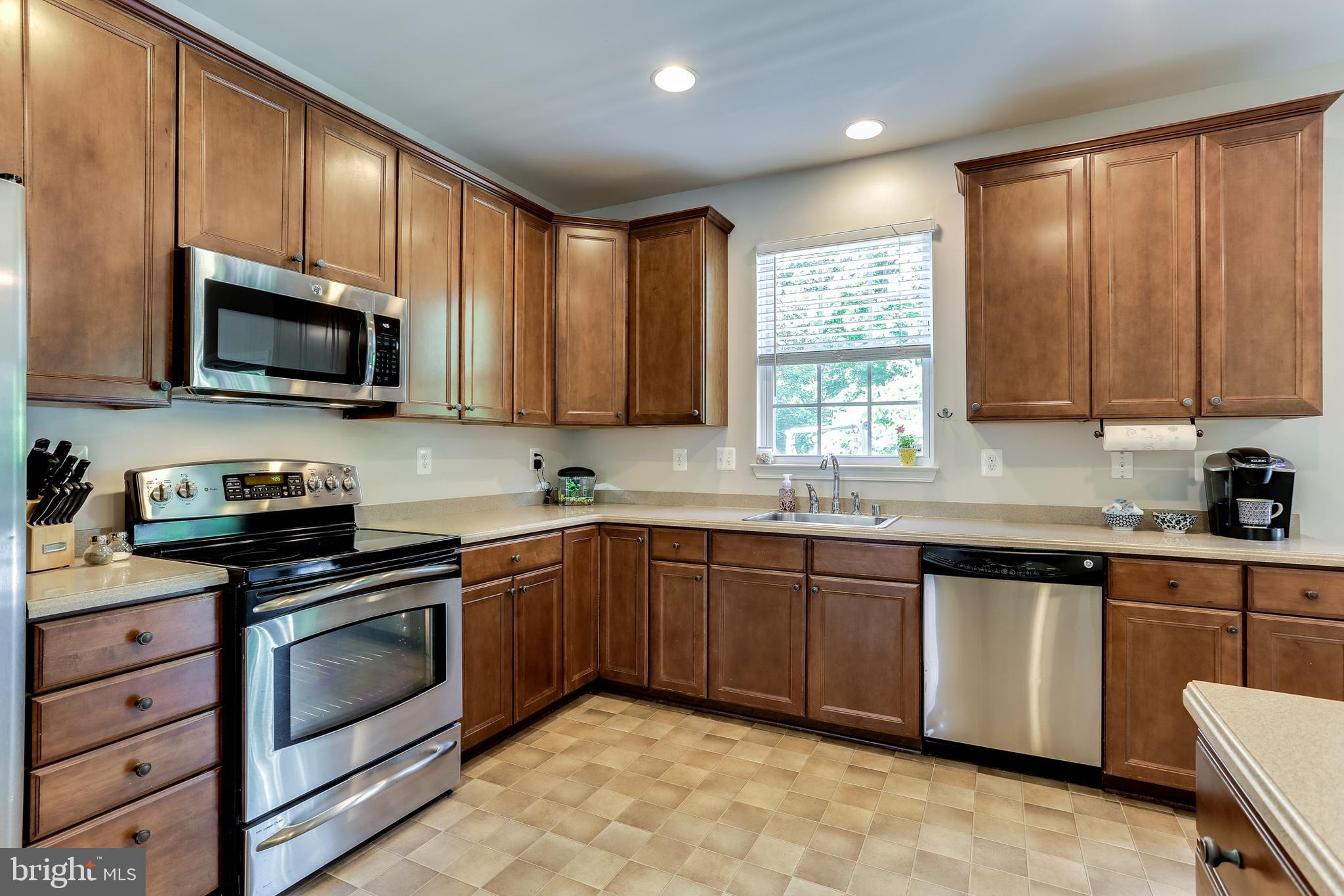 7128 Water Oak Road, Unit 244 Elkridge, MD 21075 - Photo 8 of 31 HUGE kitchen has Corian counters & recessed lights
