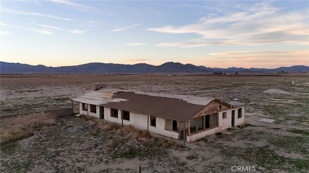 12148 Wilshire Road Lucerne Valley, CA 92356 - Photo 2 of 29 an aerial view of a house with a mountain