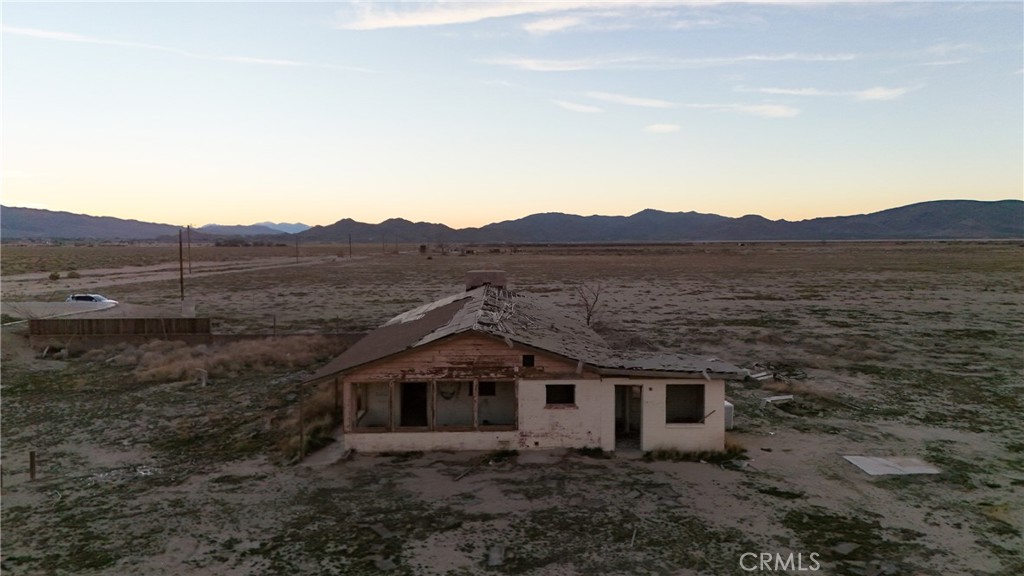 12148 Wilshire Road Lucerne Valley, CA 92356 - Photo 24 of 29 front view of a house with a yard