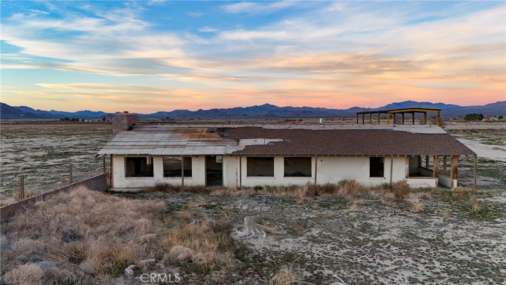12148 Wilshire Road Lucerne Valley, CA 92356 - Photo 7 of 29 front view of a house with a yard