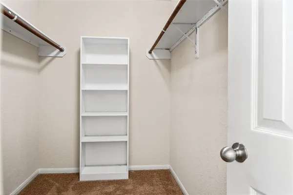 a view of a hallway with closet