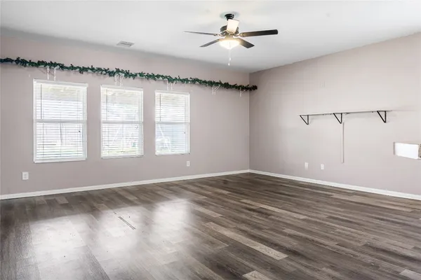 a view of a kitchen cabinets and a wooden floor