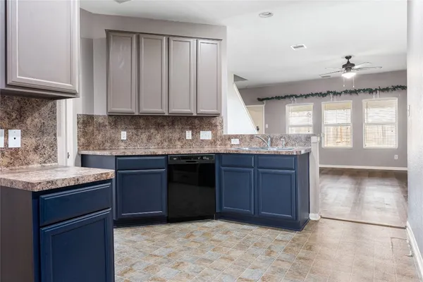 a kitchen with stainless steel appliances granite countertop a stove microwave and sink