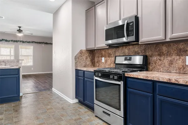 a kitchen with a sink and a refrigerator