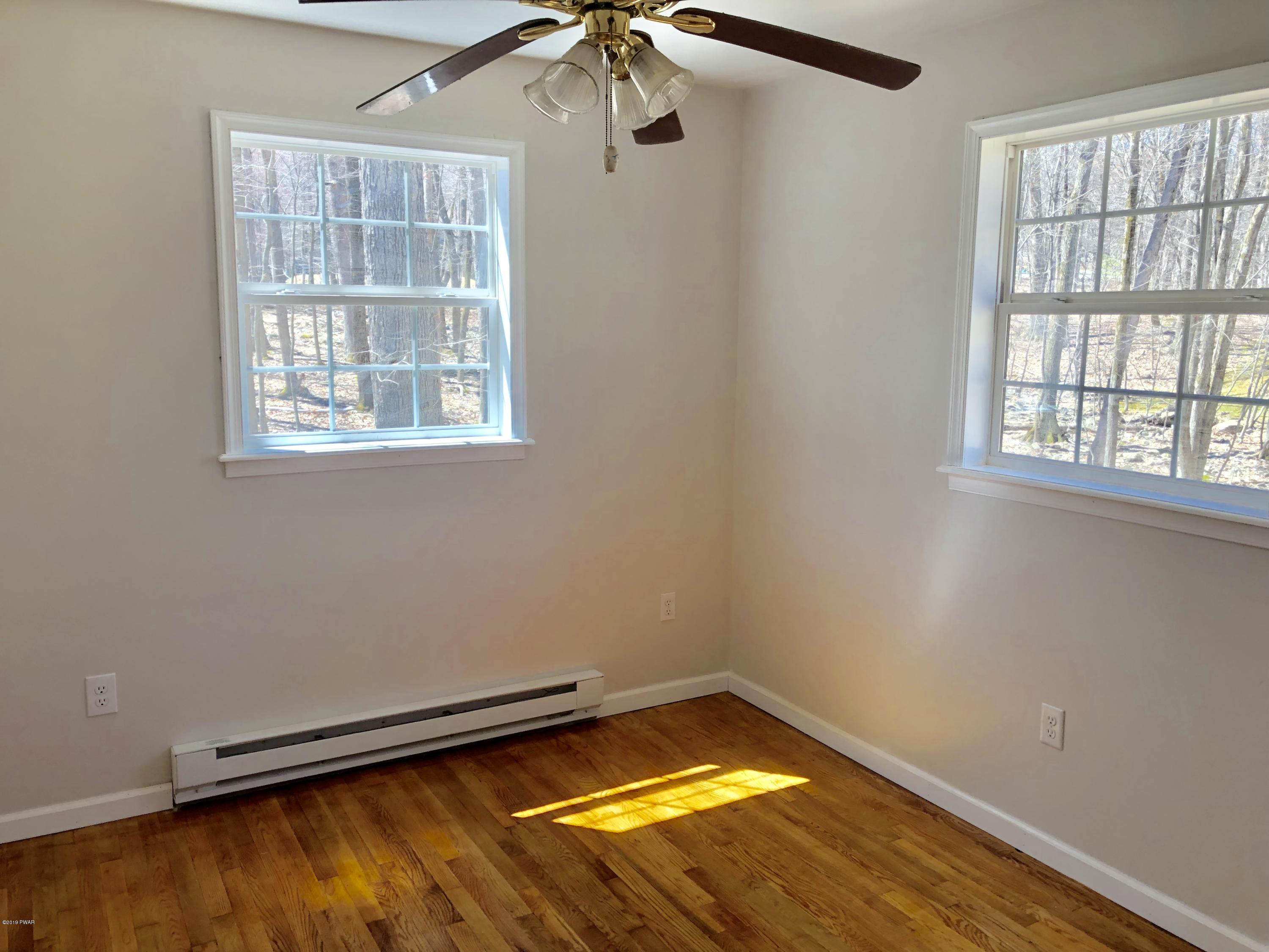 129 Slaymaker Road Milford, PA 18337 - Photo 10 of 13 an empty room with a window