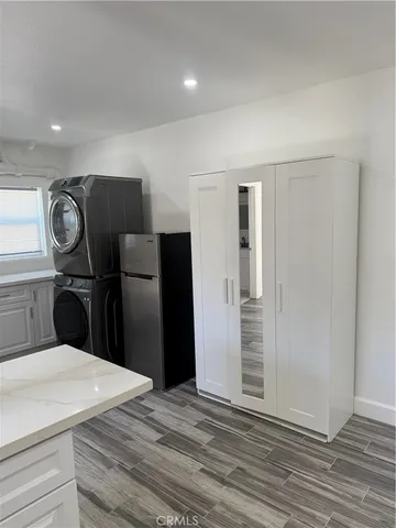 a bedroom with a bed and cabinets