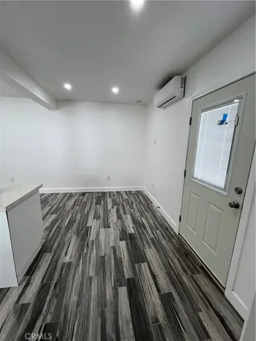 a bathroom with double vanity and a mirror