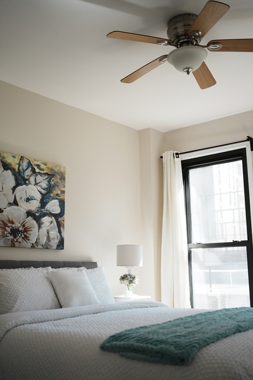 28 Juniper Street, Unit 79 Brookline, MA 02445 - Photo 22 of 23 a living room with a couch and a table