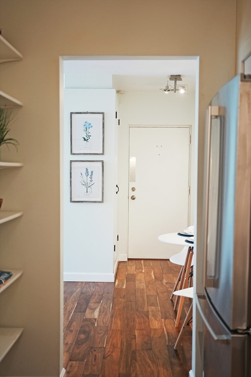 28 Juniper Street, Unit 79 Brookline, MA 02445 - Photo 4 of 23 a view of room with wooden floor and bathroom