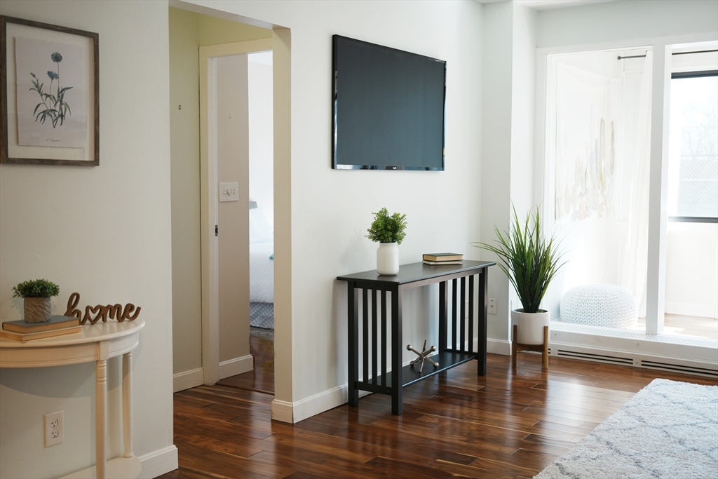 28 Juniper Street, Unit 79 Brookline, MA 02445 - Photo 8 of 23 a view of entryway with wooden floor