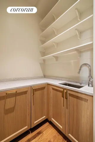 a view of a refrigerator with wooden floor