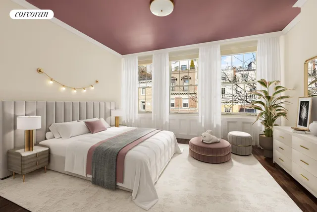 a bedroom with a bed and a large window