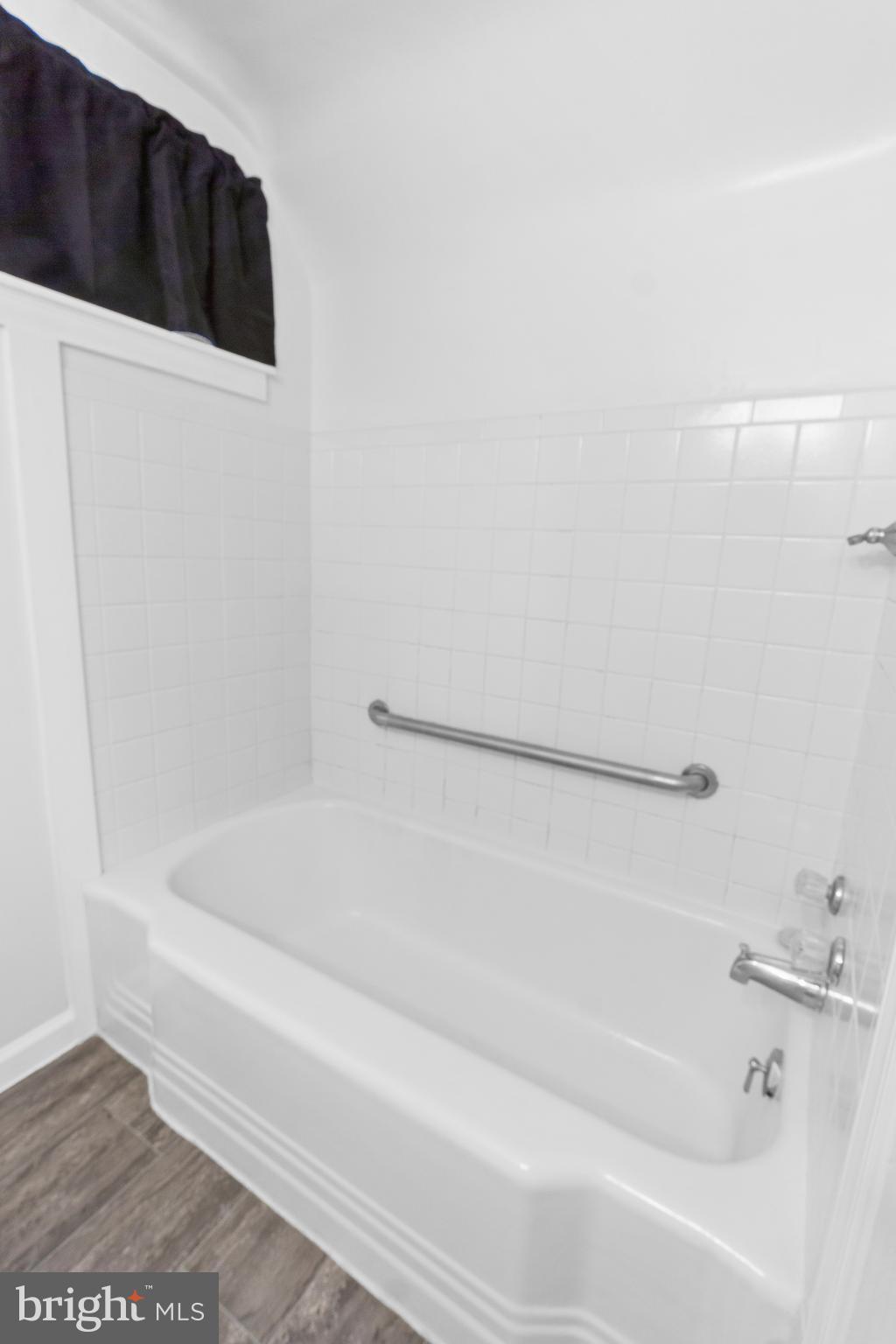 3572 Juneway, Unit 1 Baltimore, MD 21213 - Photo 12 of 23 a bathroom with a bathtub