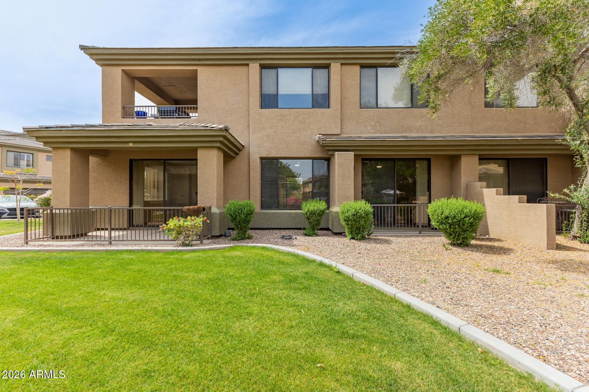705 West Queen Creek Road, Unit 1167 Chandler, AZ 85248 - Photo 28 of 31 a view of a house with a yard and plants