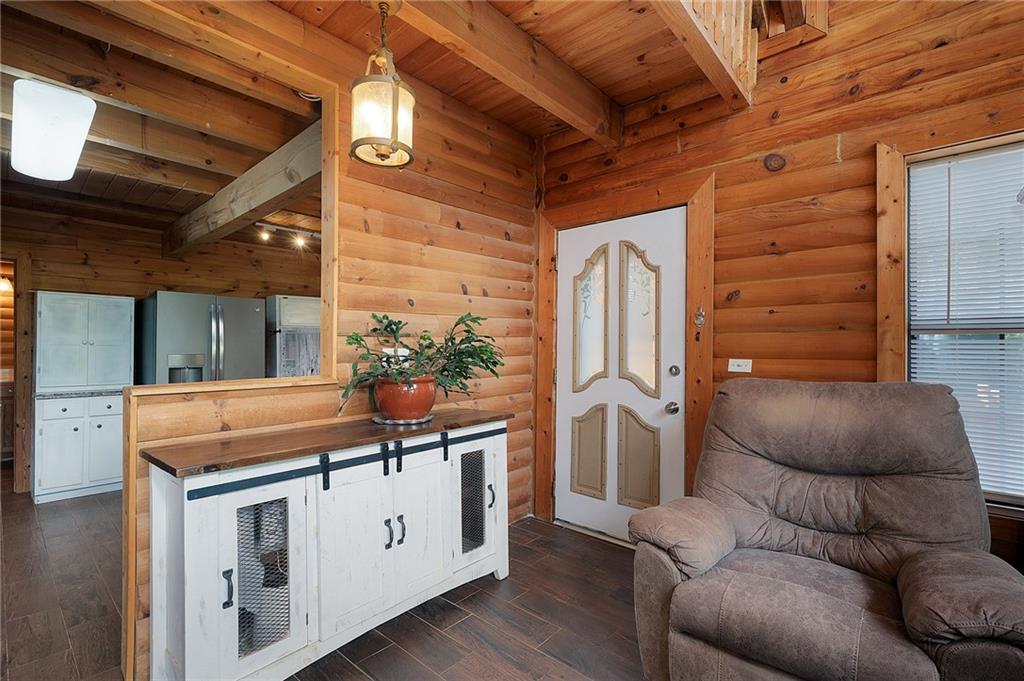 1001 Liberty Church Road Northeast Ranger, GA 30734 - Photo 16 of 40 a living room with furniture and a fireplace