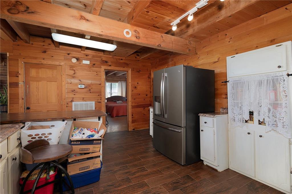 1001 Liberty Church Road Northeast Ranger, GA 30734 - Photo 17 of 40 a kitchen with stainless steel appliances wooden floor and a refrigerator